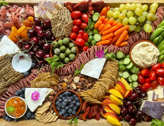 Charcuterie spread, meats, cheese, olives, crackers, nuts, etc.