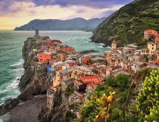 Wide shot of Cinque Terre coastal village.