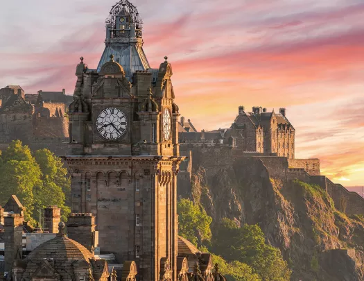 clocktower against a pink sunset