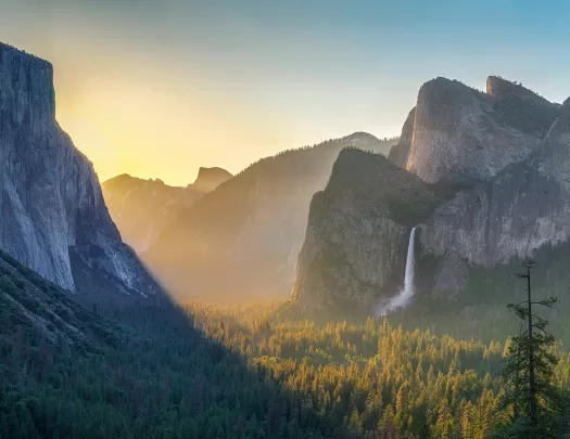 Wide shot of mountains at sunset.