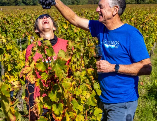 man feeding woman grapes