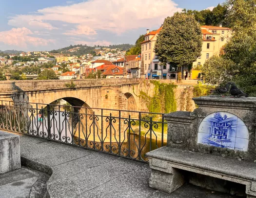 Bridge leading to a rustic town