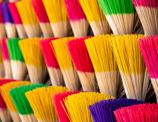 colorful incense stacked in bundles