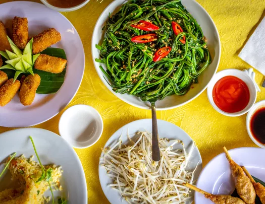 aerial view of overflowing plates on a dinner table