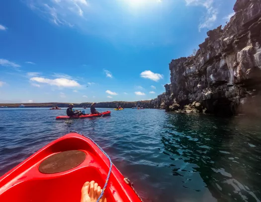 The top of a kayak in a blue lake