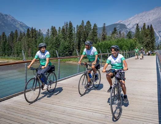Backroads guests cycling across a bridge