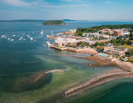 Seaside town with boats scattered in the ocean