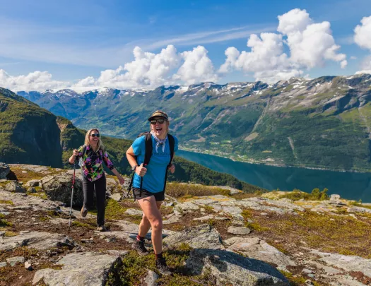 Two hikers at a summit