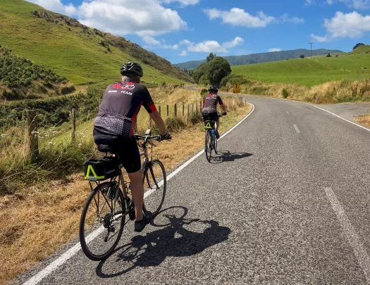 backroads guests biking down a road