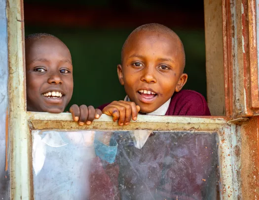 children looking out a window