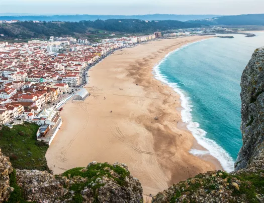 sandy beach with houses on the shore