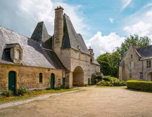 Rustic, stone church building with a dirt valley in front