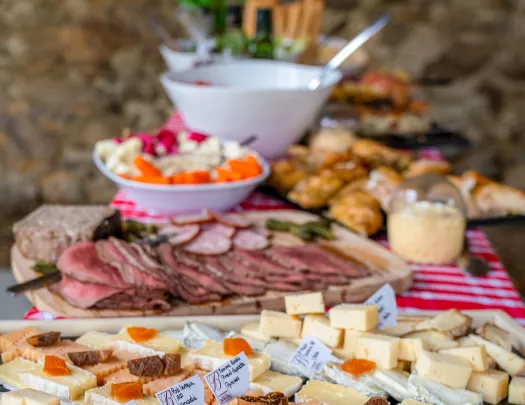 Wooden planks full of cheese and cured meats