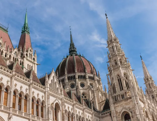 Castle-like cathedral building with clouds in the blue sky