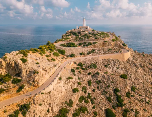 Long road along a cliff, leading to a lighthouse