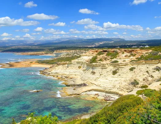 Large, yellow and orange cliffs overlooking the ocean