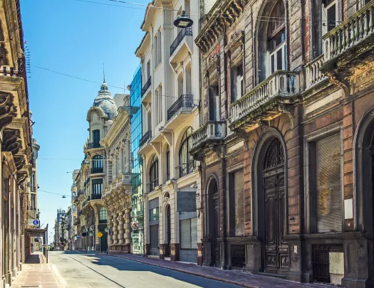 Road with large, European-style apartment buildings on either side