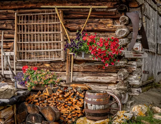 Wooden cabin with flower pots hanging outside