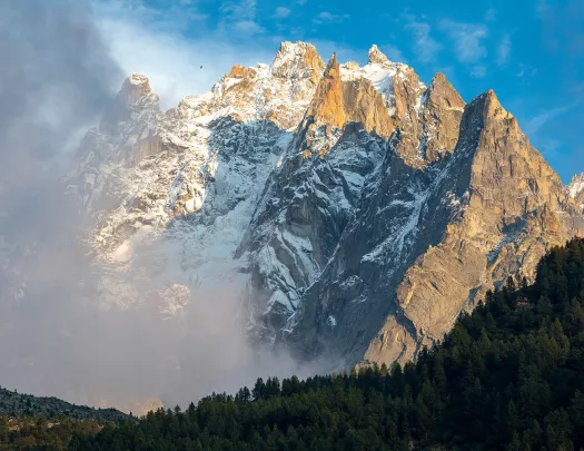 Snowy mountain covered in fog