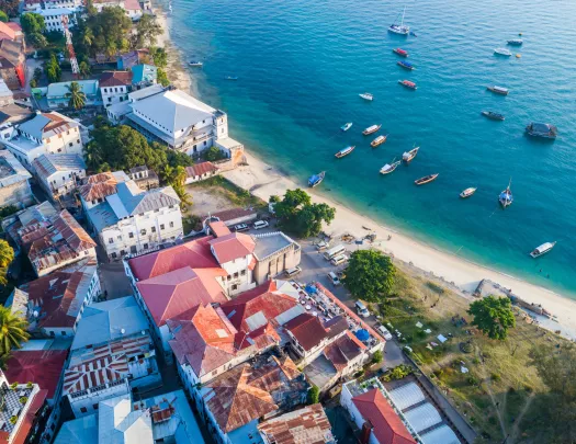 Beachside town with boats floating in the ocean