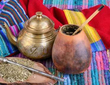 Close-up of dry yerba mate infusion pot and gourd.