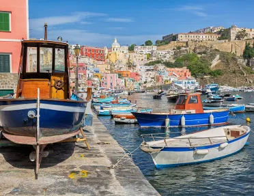 Pier on the Amalfi Coast, boast littering the water's edge.
