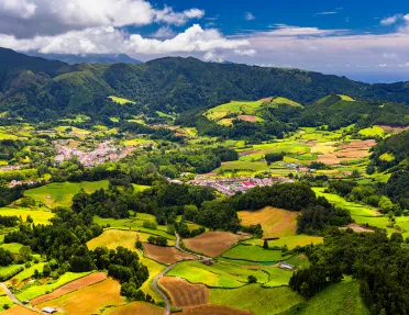 Aerial view of Lagoa das Furnas located on the Azorean island of Sao Miguel, Azores, Portugal. Lake Furnas (Lagoa das Furnas) on Sao Miguel, Azores, Portugal from the Pico do Ferro scenic viewpoint.