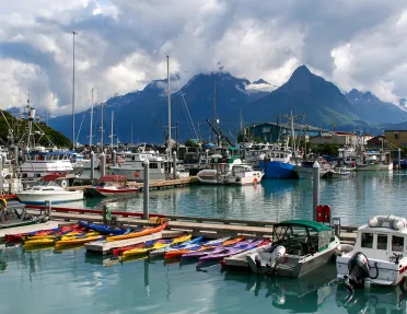 Boats sitting in a harbor atin Alaska