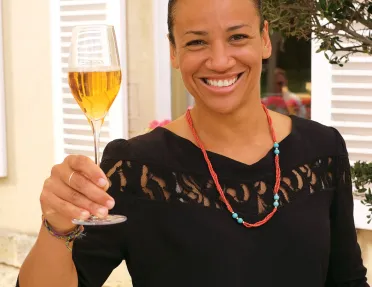 Backroads Guest Smiling with Wine