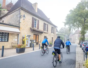 Backroads Guests Biking Through Town