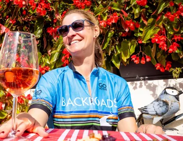 Biker enjoying a glass of rose wine.