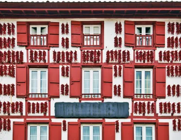 Red Espelette Peppers Drying in the Wall of a Traditional Basque House in Espelette Village, Basque Province of Labourd, France