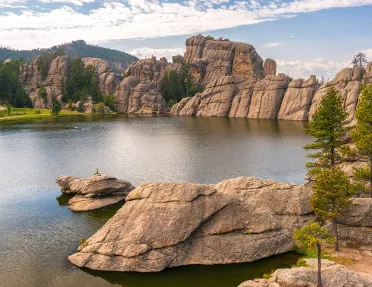 Rock formation and lagoon with trees