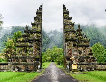 Shot of shrine/gateway in Bali, forest behind.