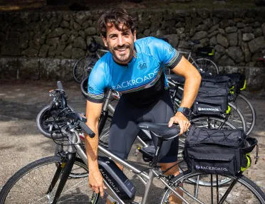 Backroads leader fixing e-bike.