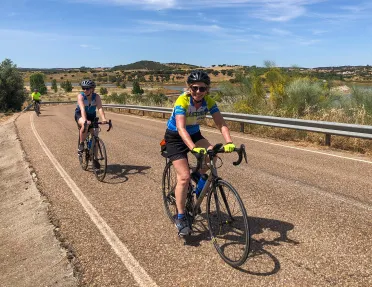 Three bikers riding on a road in Portugal.