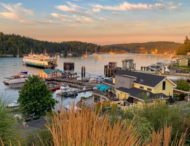 Wide shot of ferry port at sundown.