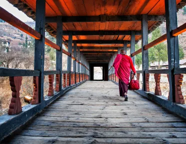 Monk walking along a corridor in Bhutan