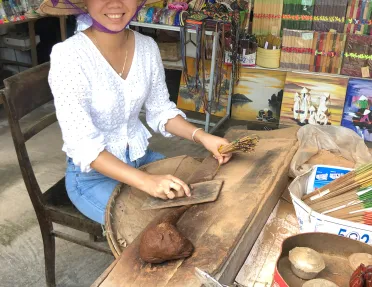 Local Vietnamese woman preparing food