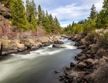 Wide shot of quickly flowing river.