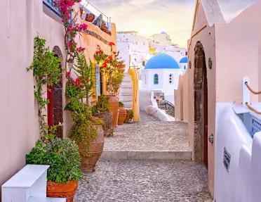 Alleyway shot looking towards Med. coast, blue and white houses, etc.