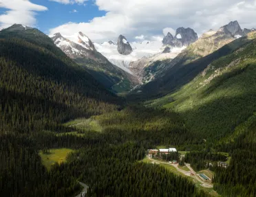 Bird's eye shot of Bugaboos, small valley housing below.