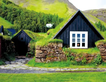 Cottage on the mountainside with grass roof