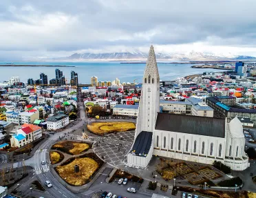 Bird's eye shot of The Hallgrimskirkja and it's surrounding city.