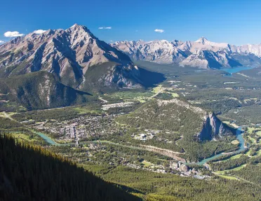 Bird's eye shot of Banff among the mountains.