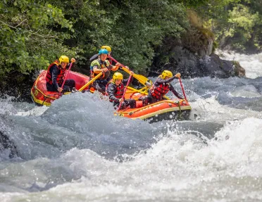 Five guests white water rafting.