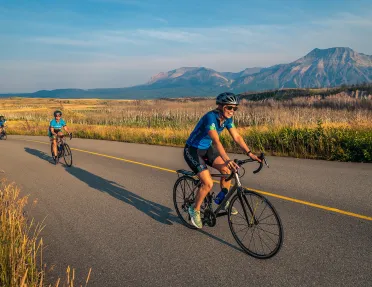 Backroads guests riding through golden fields