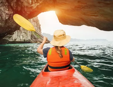 Kayaking among stone arches and cliffs in Vietnam