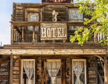 Storefront shot of the "MANE STREET HOTEL", old west style building.