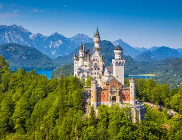 Beautiful view of world-famous Neuschwanstein Castle, the 19th century Romanesque Revival palace built for King Ludwig II, with scenic mountain landscape near Fussen, southwest Bavaria, Germany